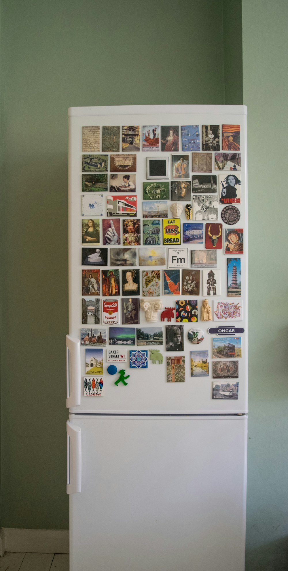 white top mount refrigerator with stickers