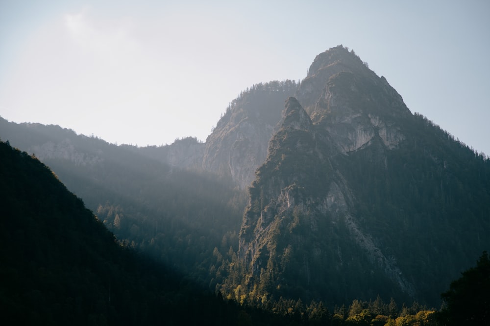 green and brown mountain under white sky during daytime