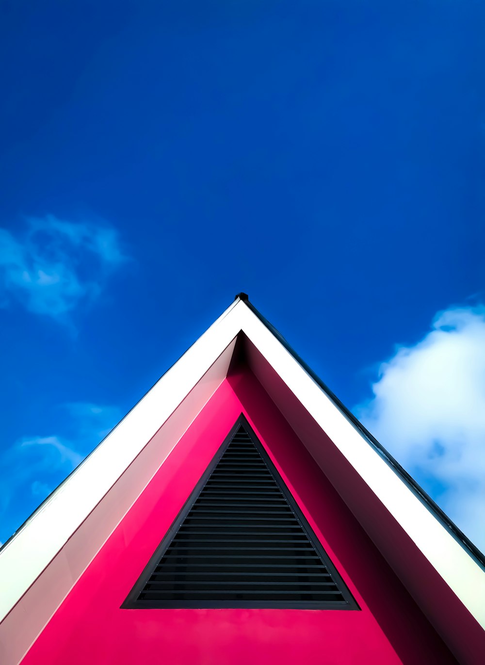 red and white concrete building under blue sky during daytime