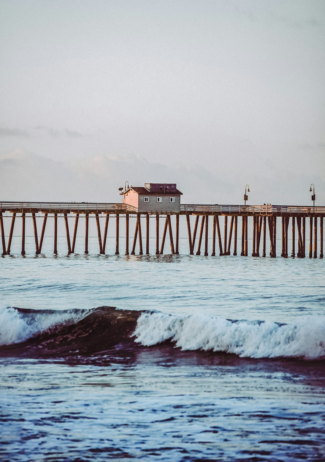 brown wooden dock on sea during daytime