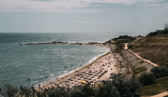 people on beach during daytime in Eforie Sud Romania