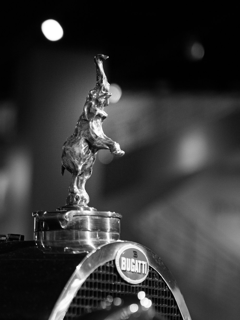 grayscale photo of clear glass jar