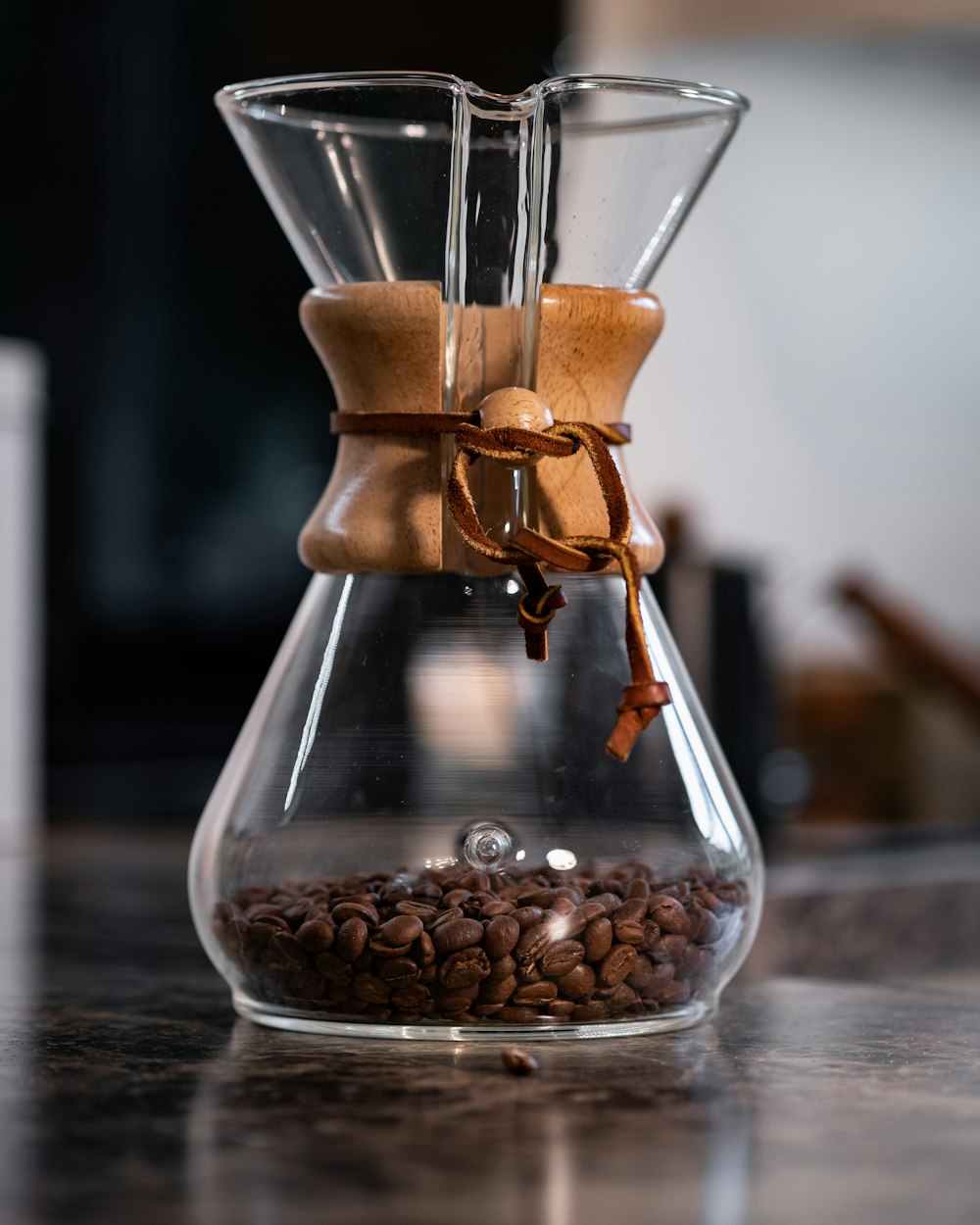 clear glass jar with brown coffee beans