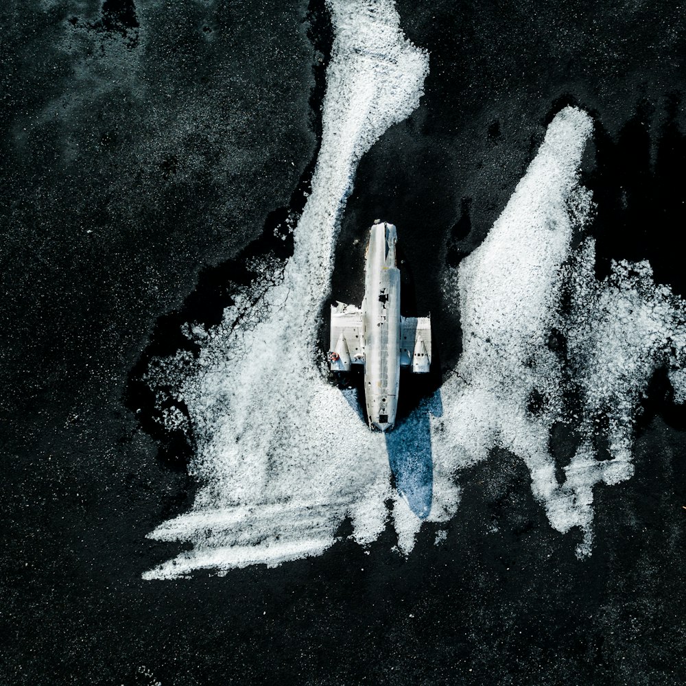 aerial view of white boat on body of water during daytime