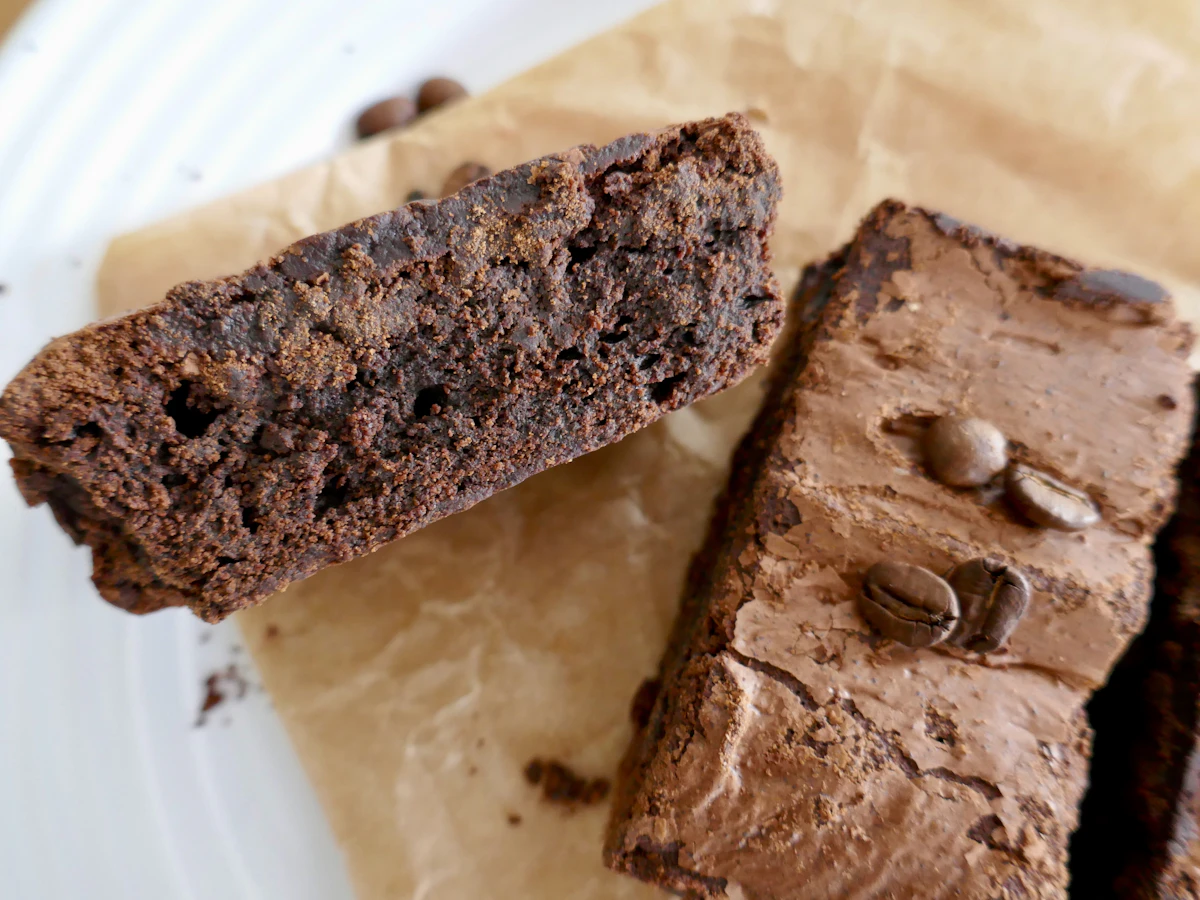 Infused chocolate brownies on parchment paper, a common baked cannabis edible format