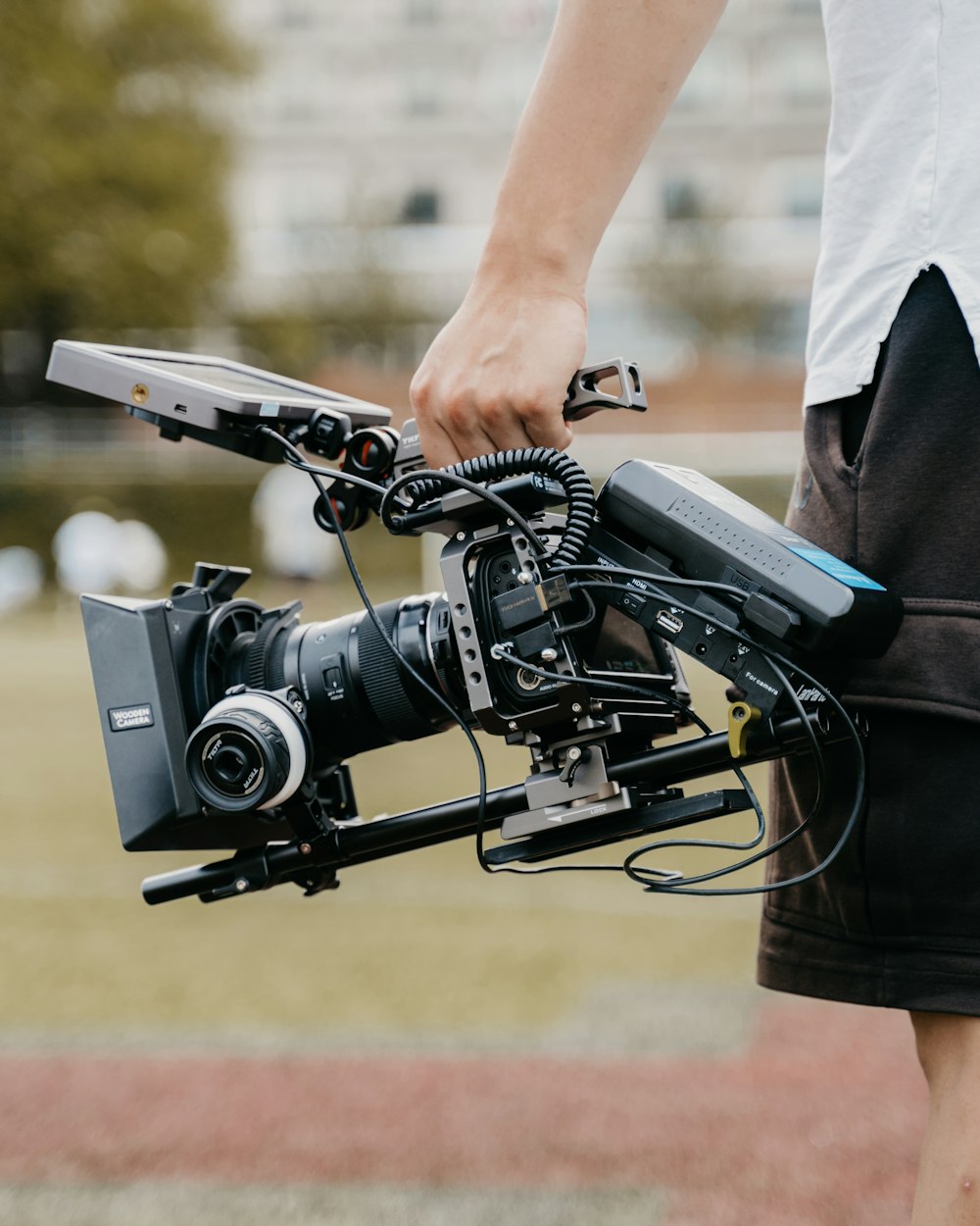 person in black t-shirt holding black camera