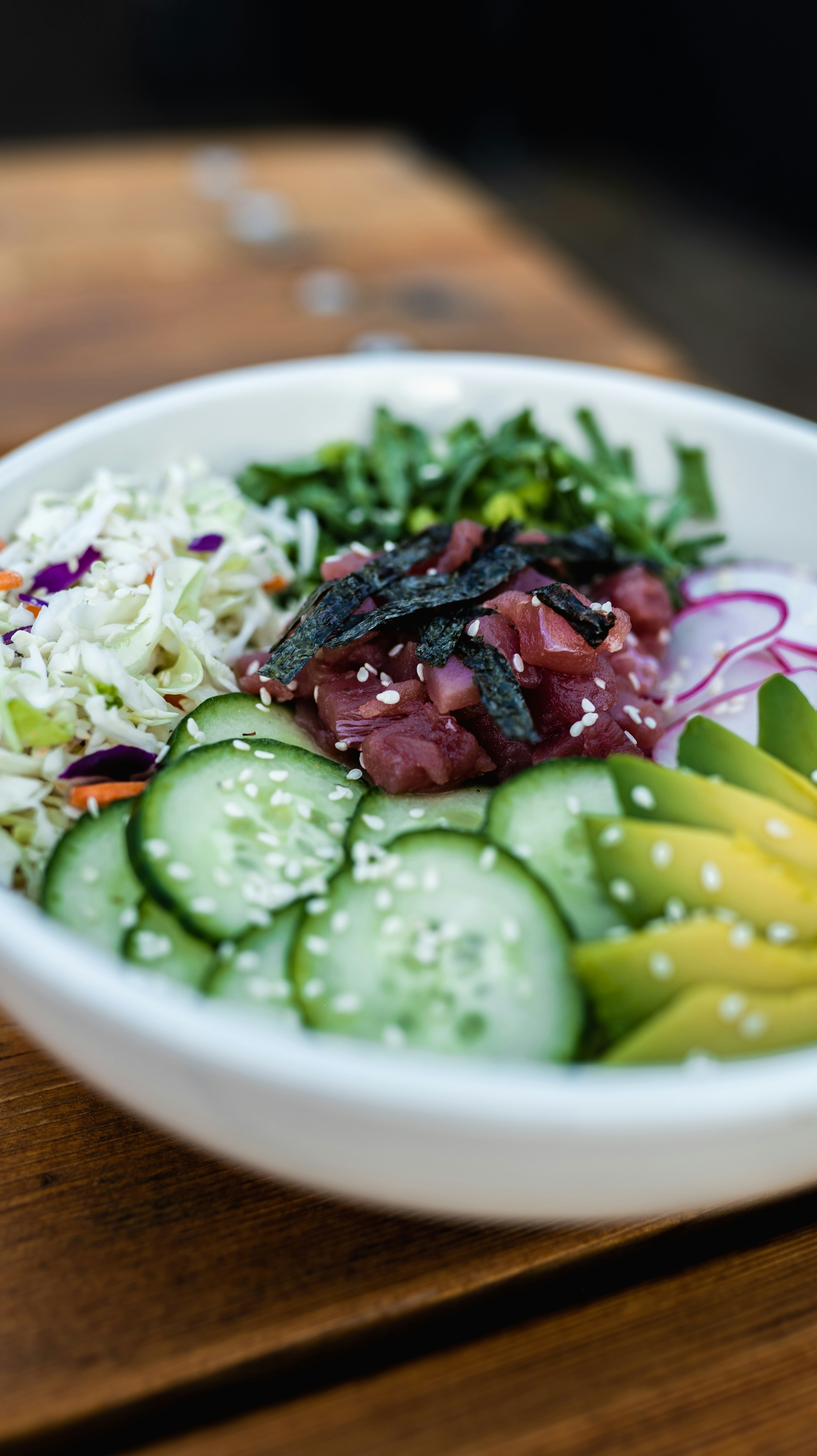 sliced cucumber on white ceramic bowl