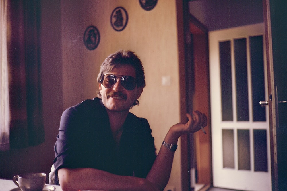 woman in black shirt wearing black sunglasses