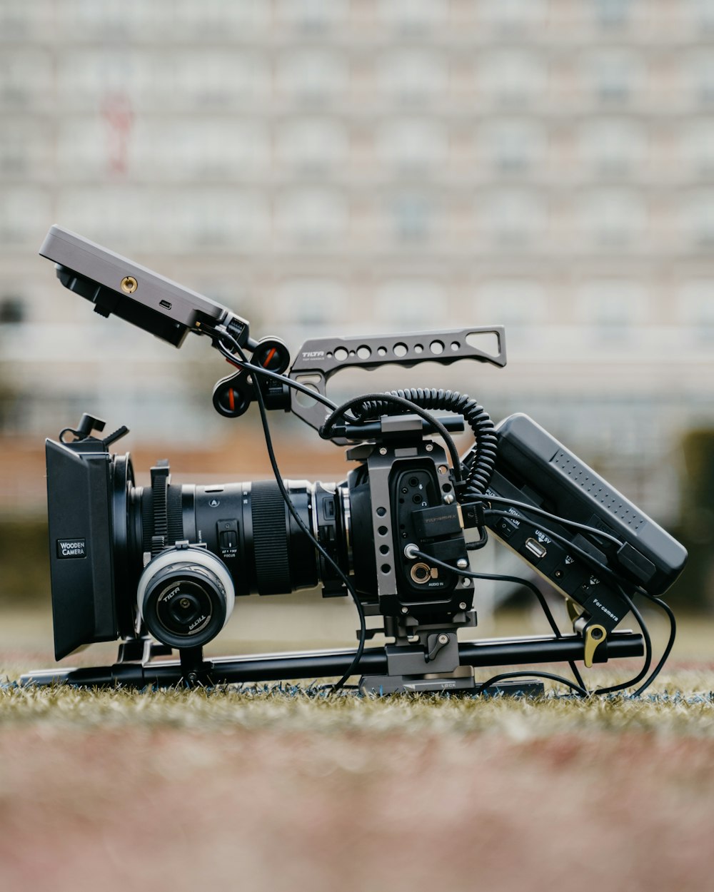 black dslr camera on brown textile