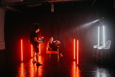 3 women sitting on chair playing musical instruments