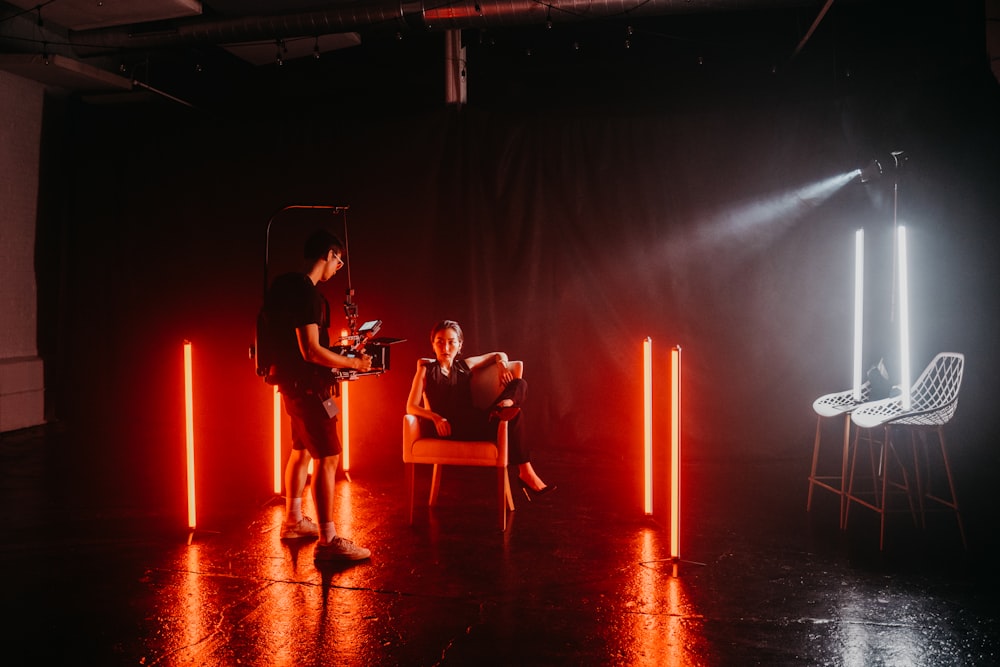 3 women sitting on chair playing musical instruments