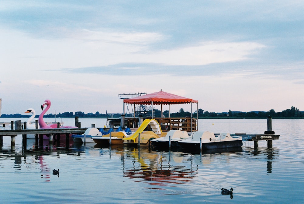 boat on water near dock during daytime