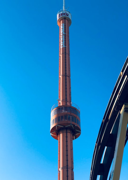 gray and black tower under blue sky during daytime in La Ronde Canada