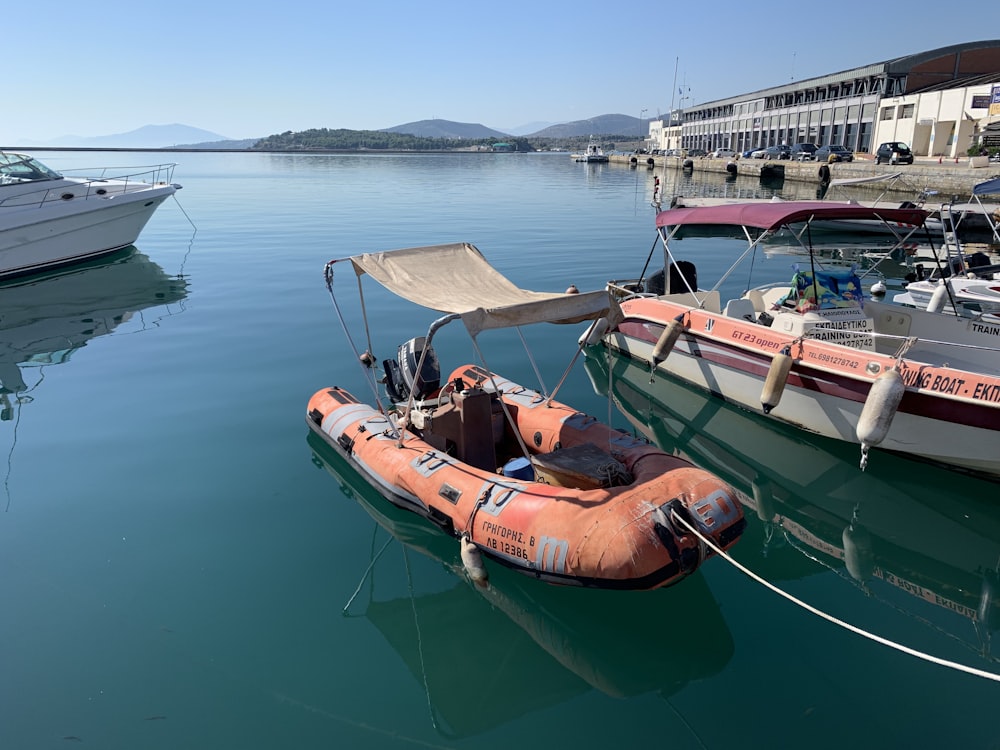 brown and white boat on body of water during daytime