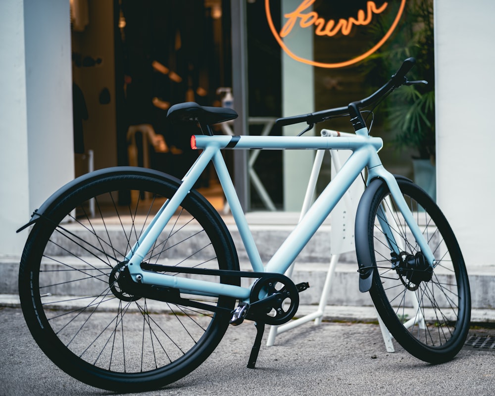 white and black bicycle on gray concrete floor