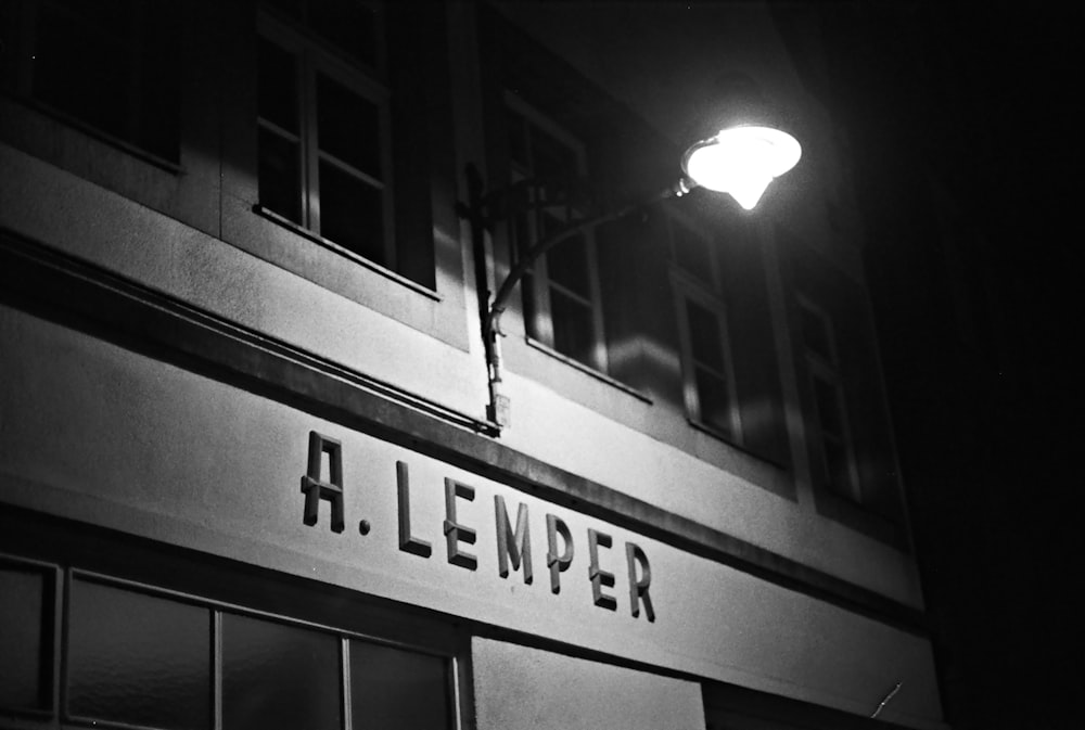 a black and white photo of a building at night