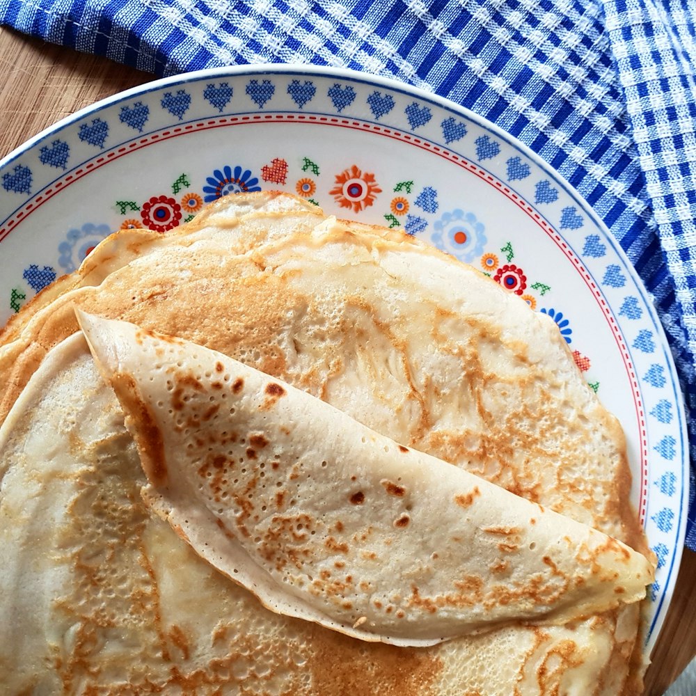 white and blue ceramic plate