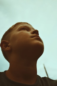 A hopeful young person receiving support and encouragement during a counseling session.