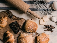 brown wooden rolling pin beside brown wooden rolling pin