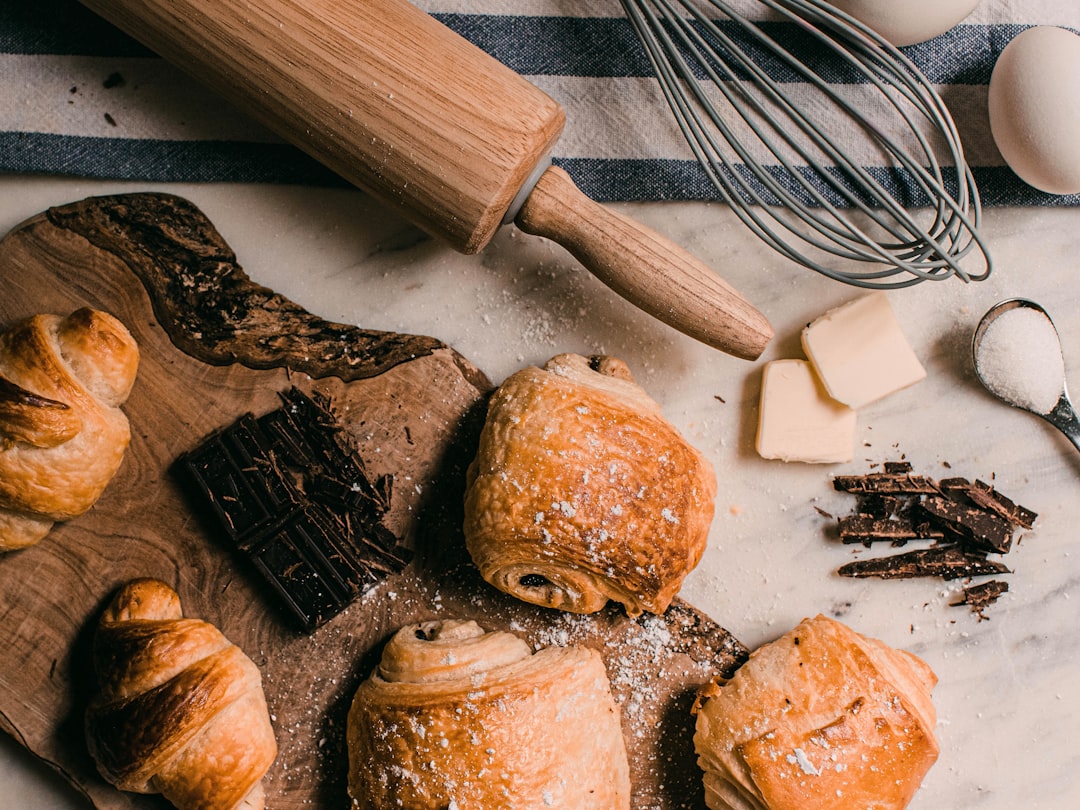  brown wooden rolling pin beside brown wooden rolling pin rollong pin