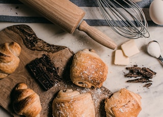 brown wooden rolling pin beside brown wooden rolling pin