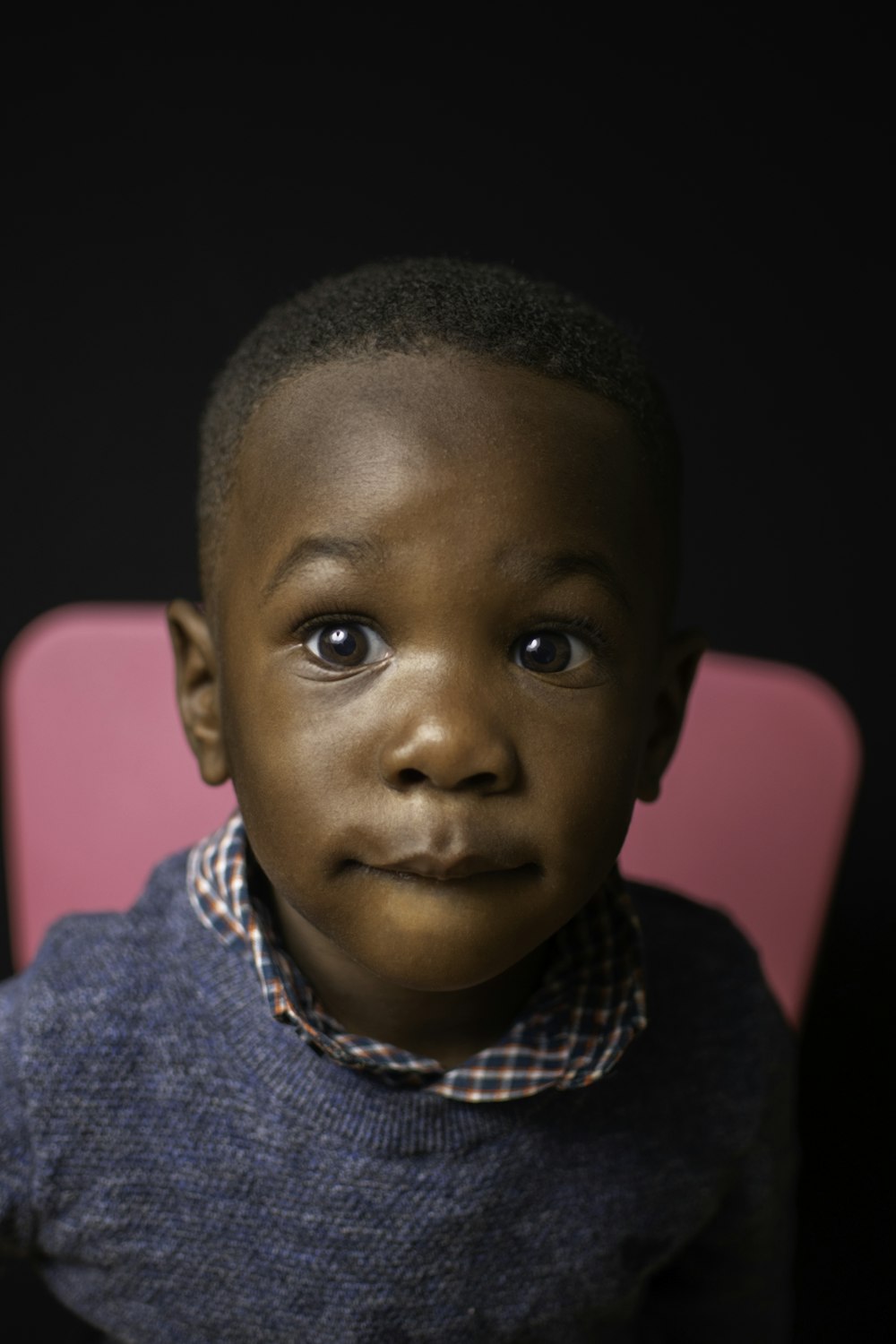 boy in blue and white collared shirt