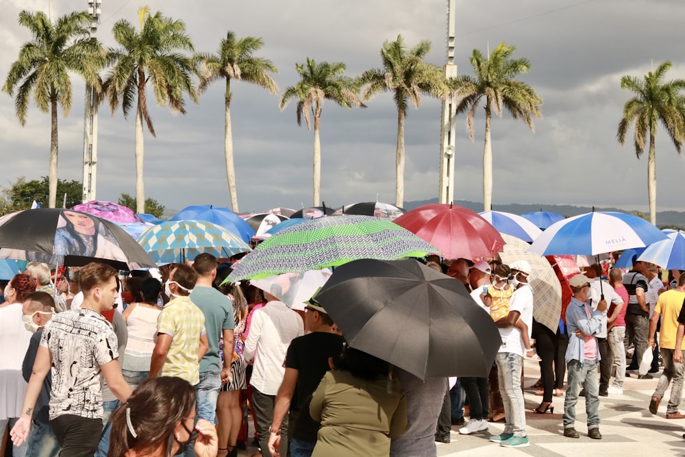 people walking on beach during daytime