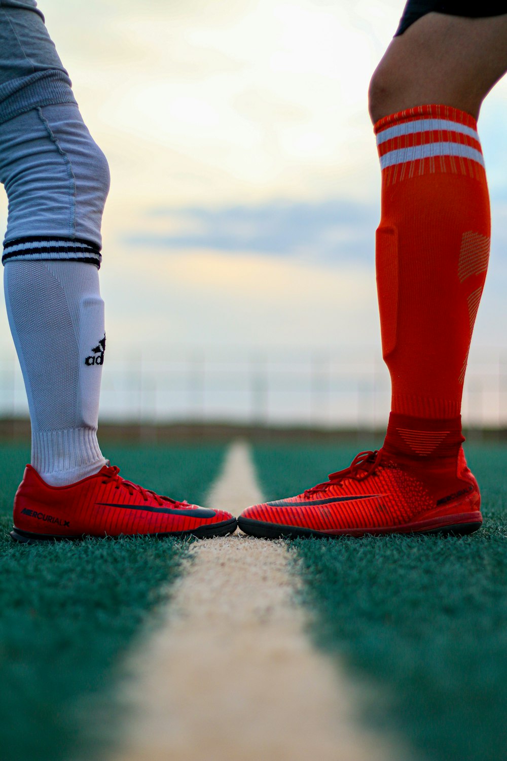 person in red and white nike socks