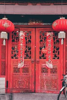 red chinese lanterns on red wooden door