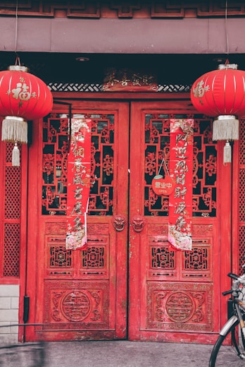 red chinese lanterns on red wooden door
