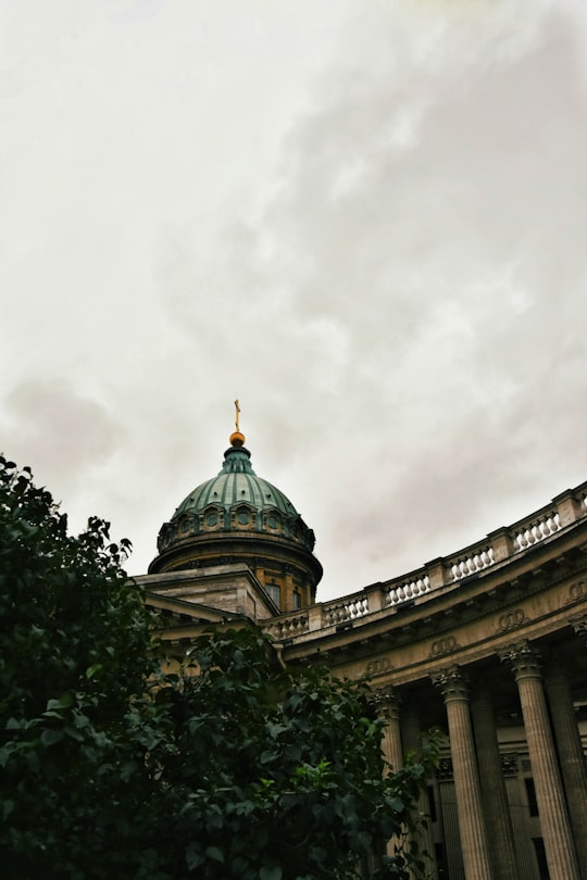 green and brown dome building under white clouds in Kazan Cathedral Russia