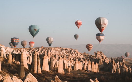 hot air balloons on the sky during daytime in Kapadokya Turkey