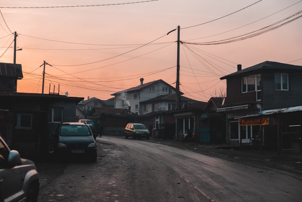 black car parked beside house during daytime