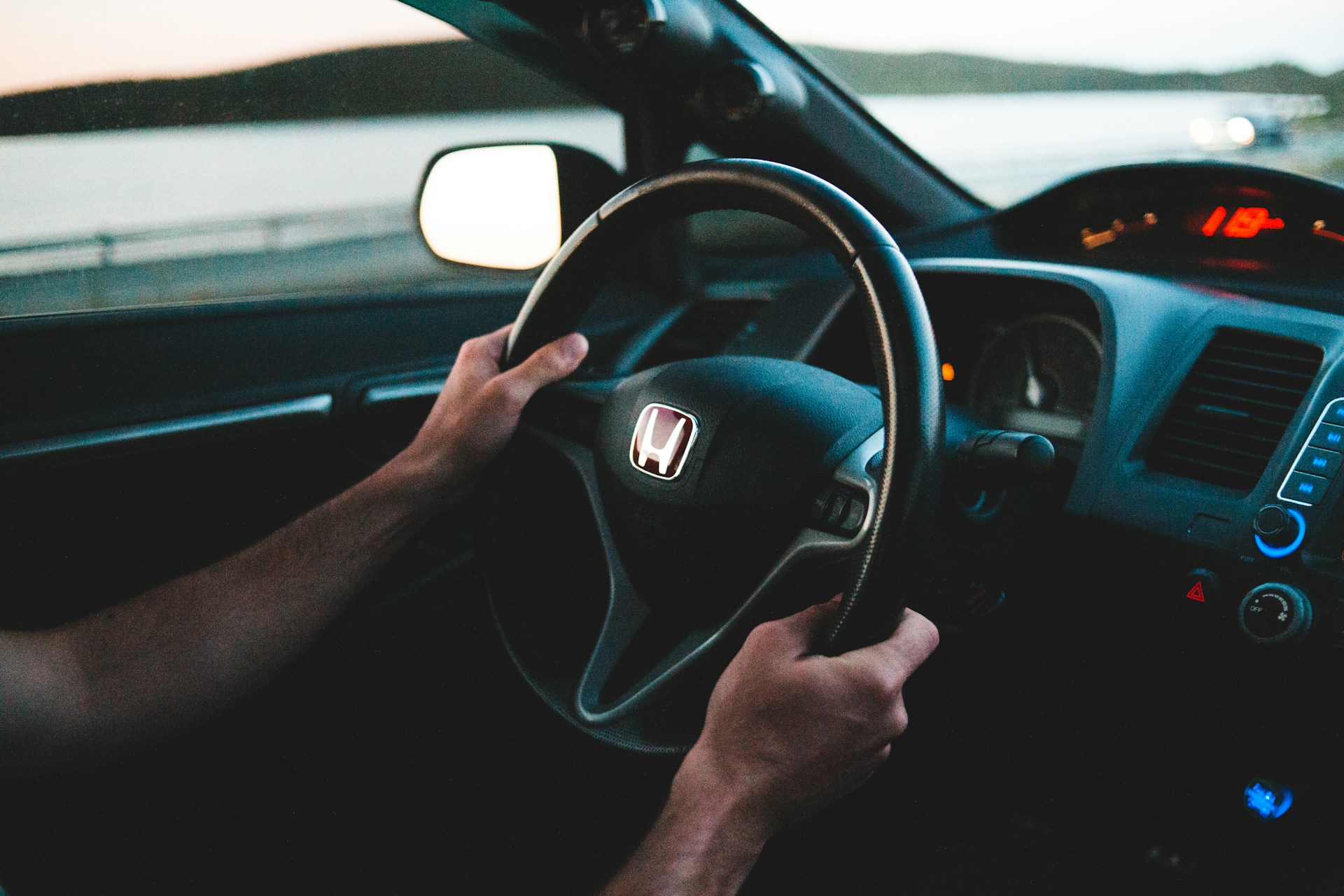 woman wearing yellow long-sleeved dress under white clouds and blue sky during daytime
