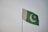 green and white flag under white sky during daytime
