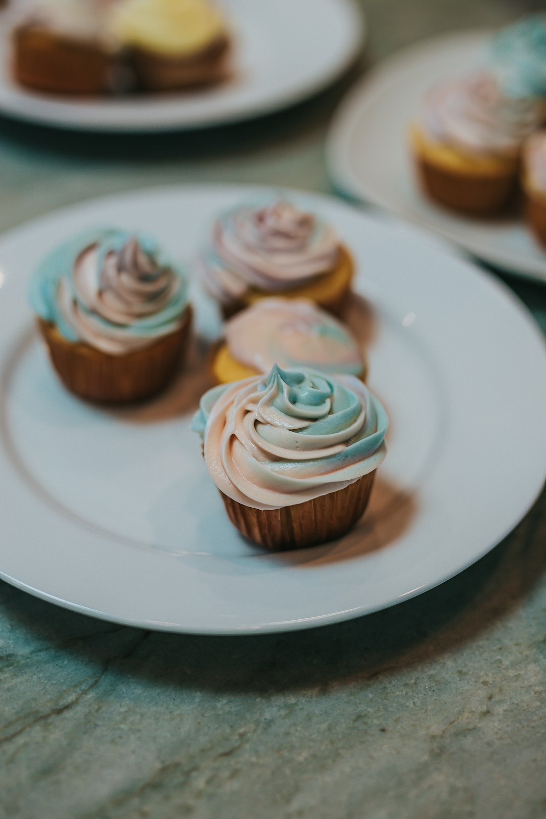 two cupcakes on white ceramic plate