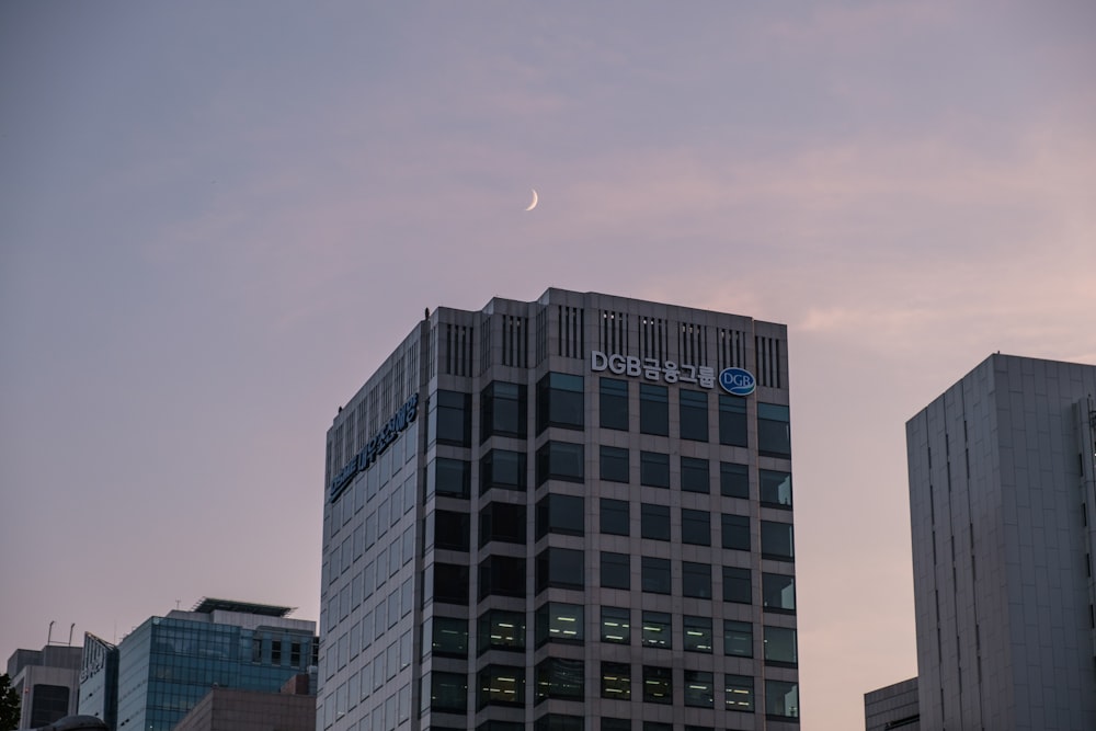 white and black concrete building under white sky during daytime