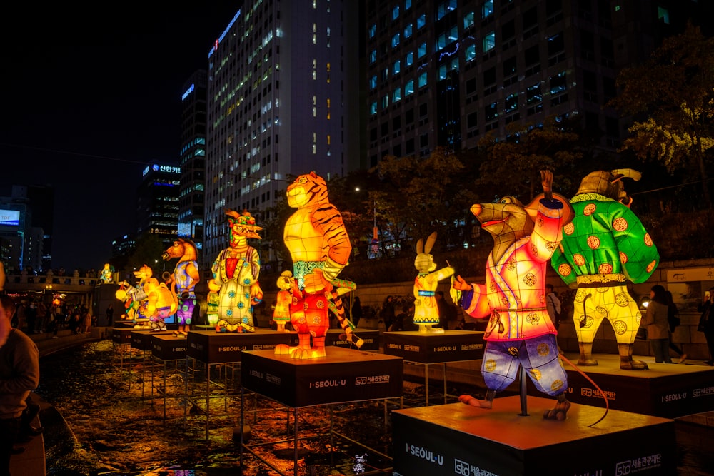 people standing on brown wooden table during night time