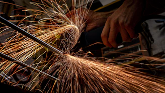 person holding brown and white fireworks