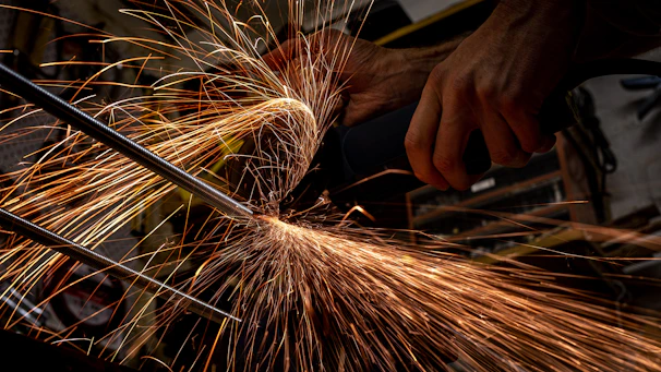 person holding brown and white fireworks