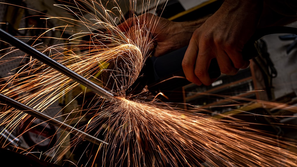 person holding brown and white fireworks