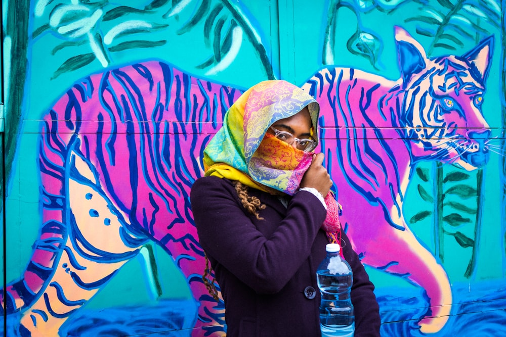 woman in black long sleeve shirt wearing yellow and green hijab