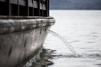 A close-up of a boat's water tank being filled with fresh water by Aquamavi staff.