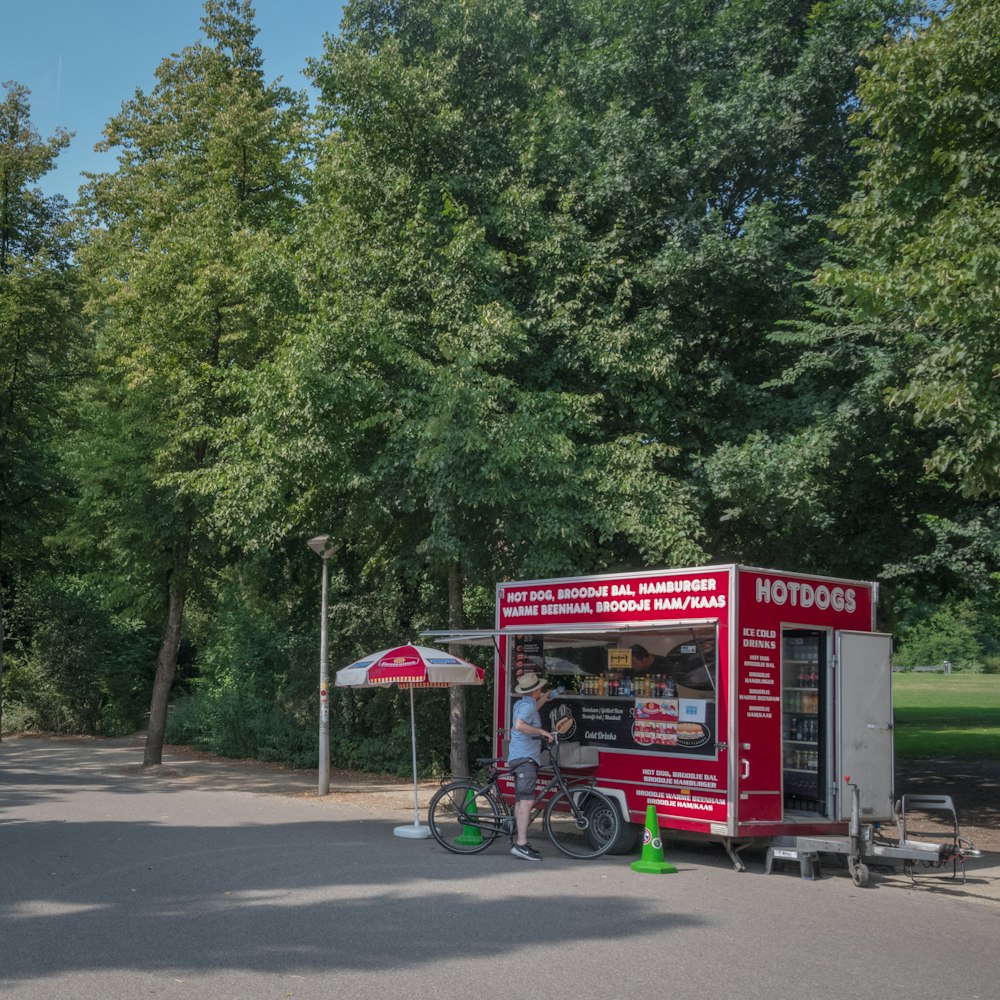 red and white food truck on road during daytime