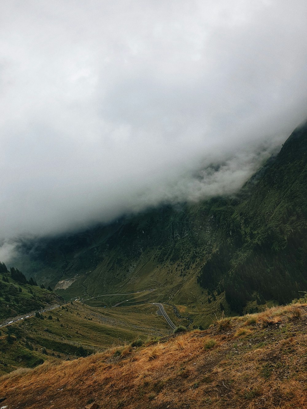 green mountains under white clouds during daytime