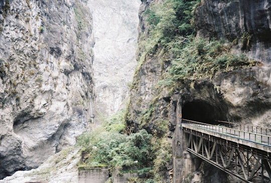 gray concrete bridge on rocky mountain in Taroko National Park Taiwan