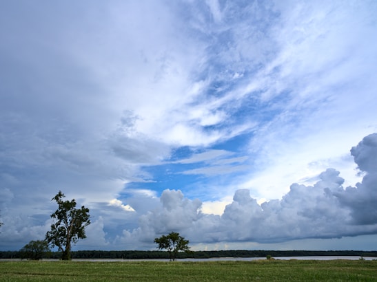A dynamic screenshot of the Skywars mode showing players battling on floating islands under a bright sky.