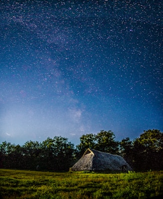 brown house under blue sky during night time
