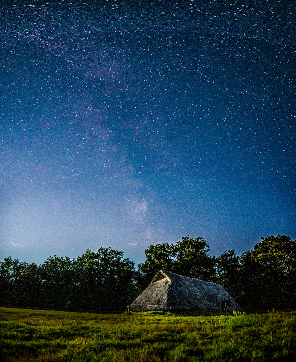 brown house under blue sky during night time