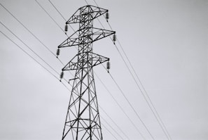 black electric tower under white sky